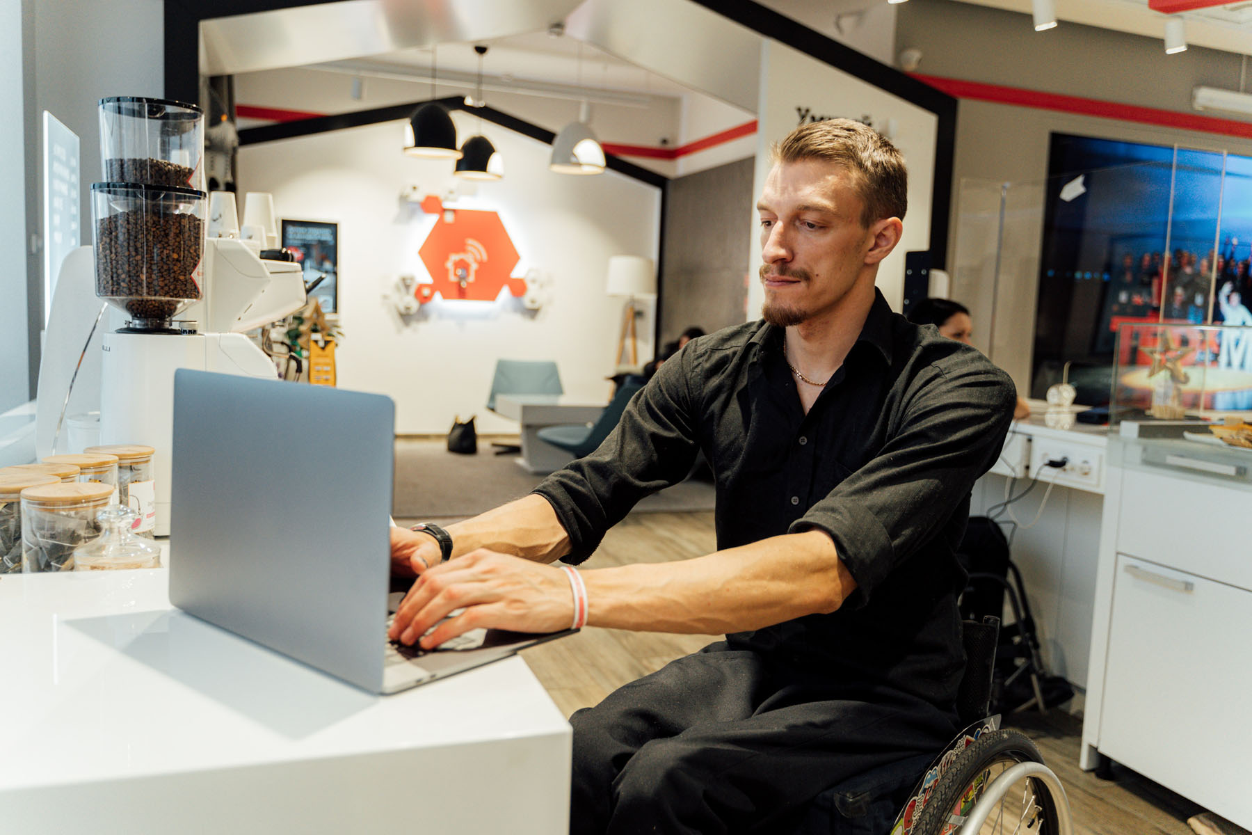 pexels-rodnae-productions-7414041 Person using laptop in an inclusive workspace, researching funding opportunities on the GrantFinder database