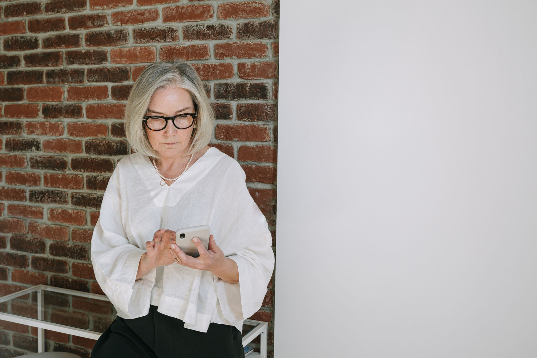 Entrepreneur reviewing Henley Business Angels investment opportunities on smartphone