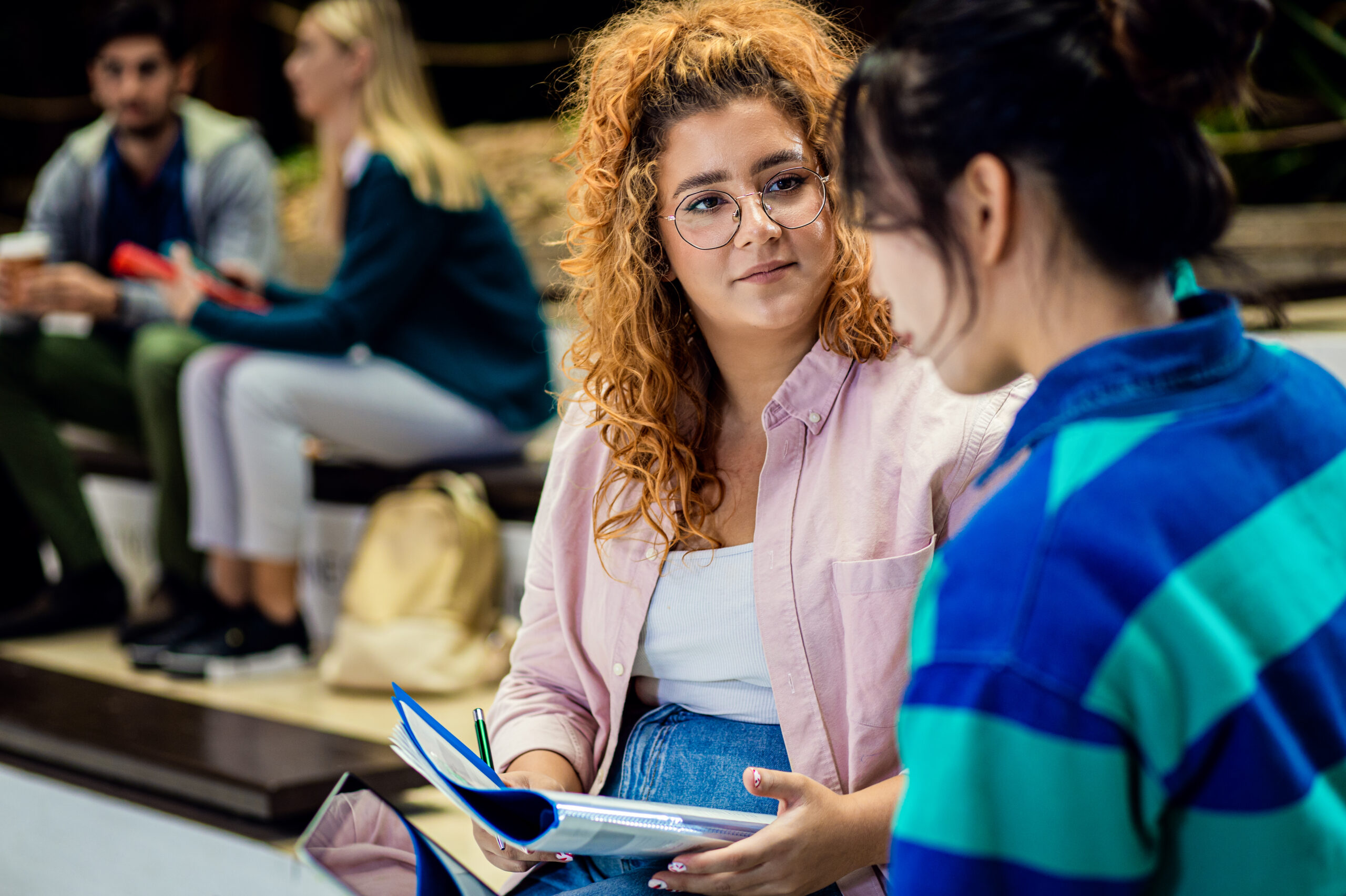 Students sitting on campus, Careers education, Careers Hub.
