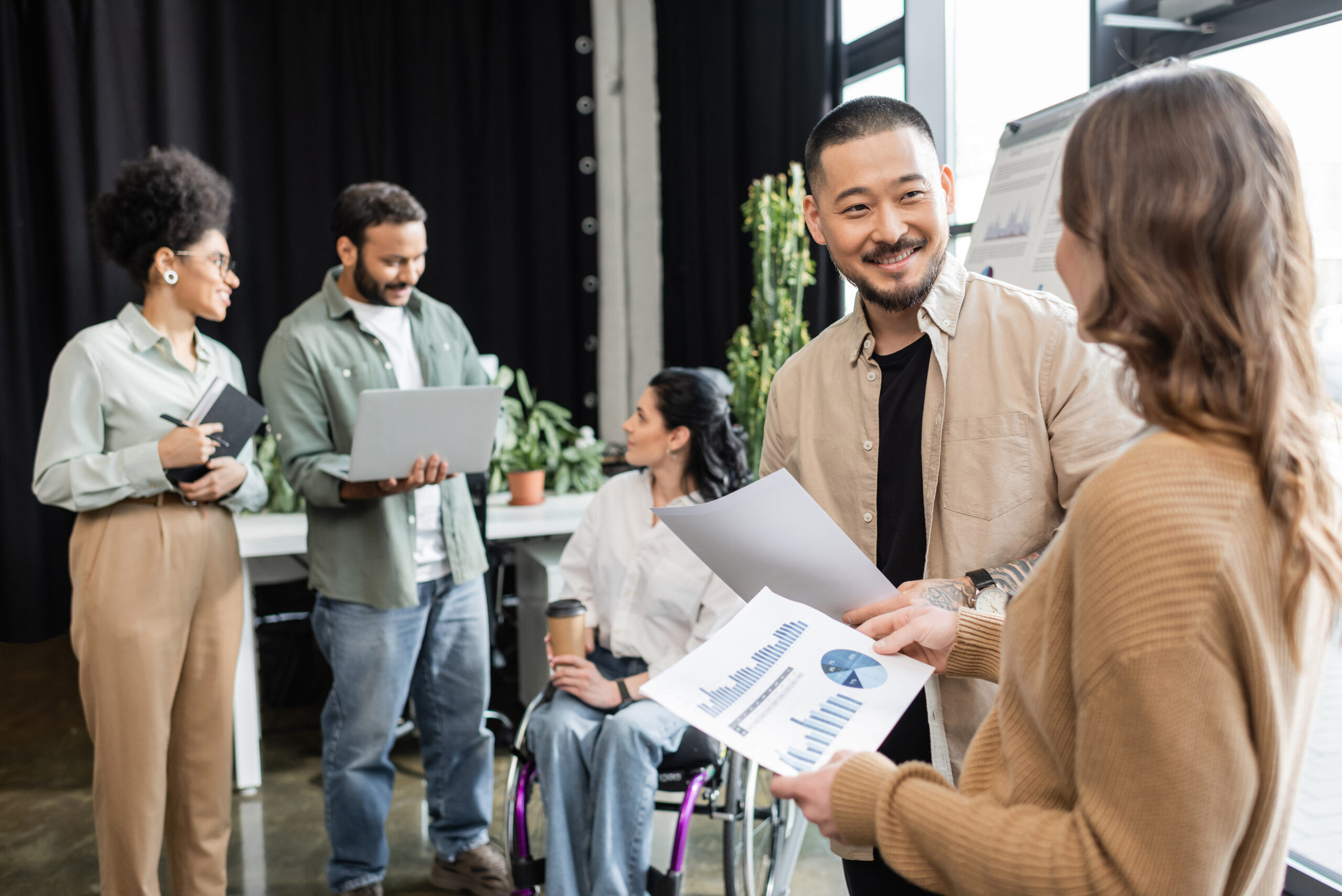Multicultural people shaking hands during a meeting