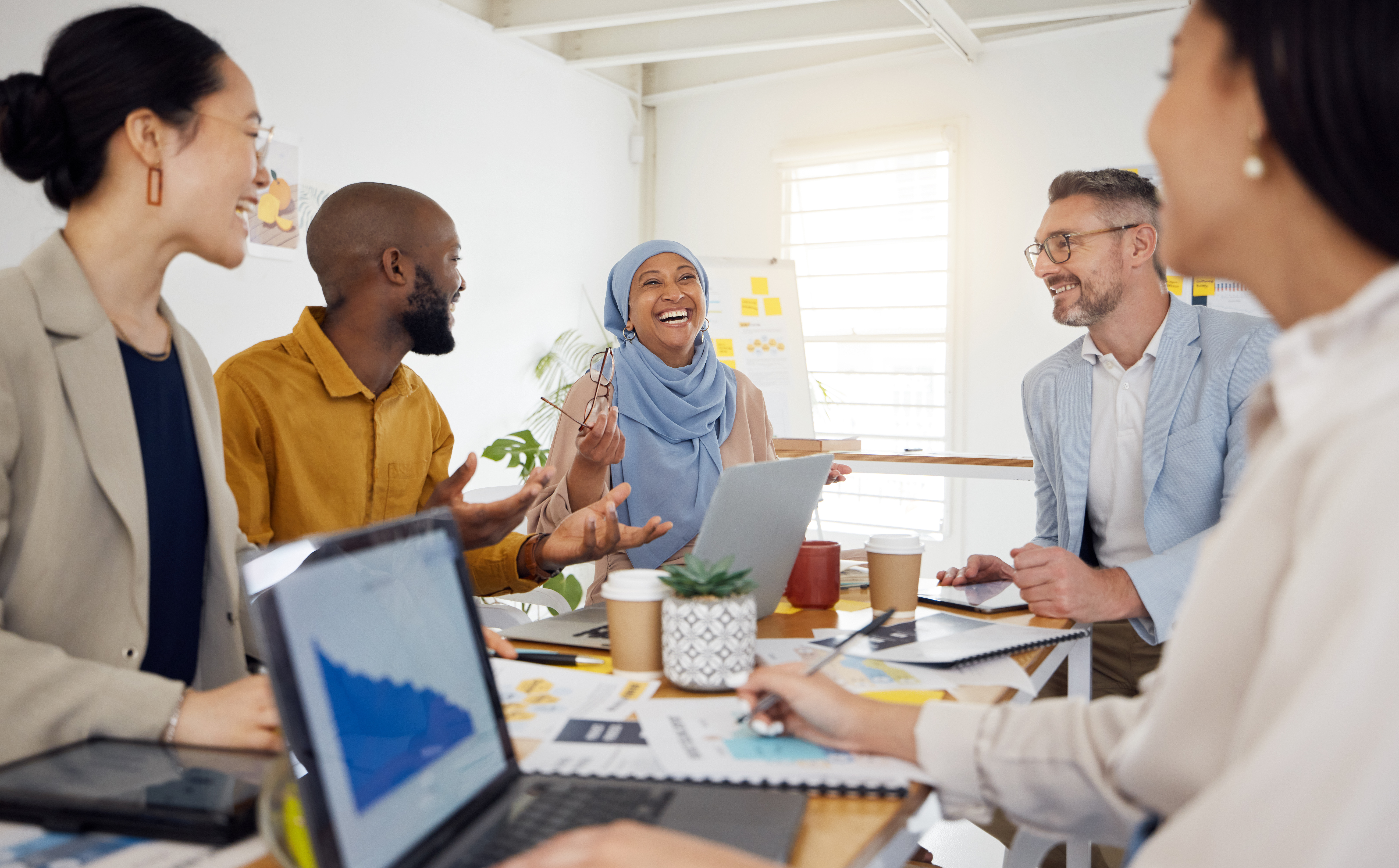 Multicultural people shaking hands during a meeting