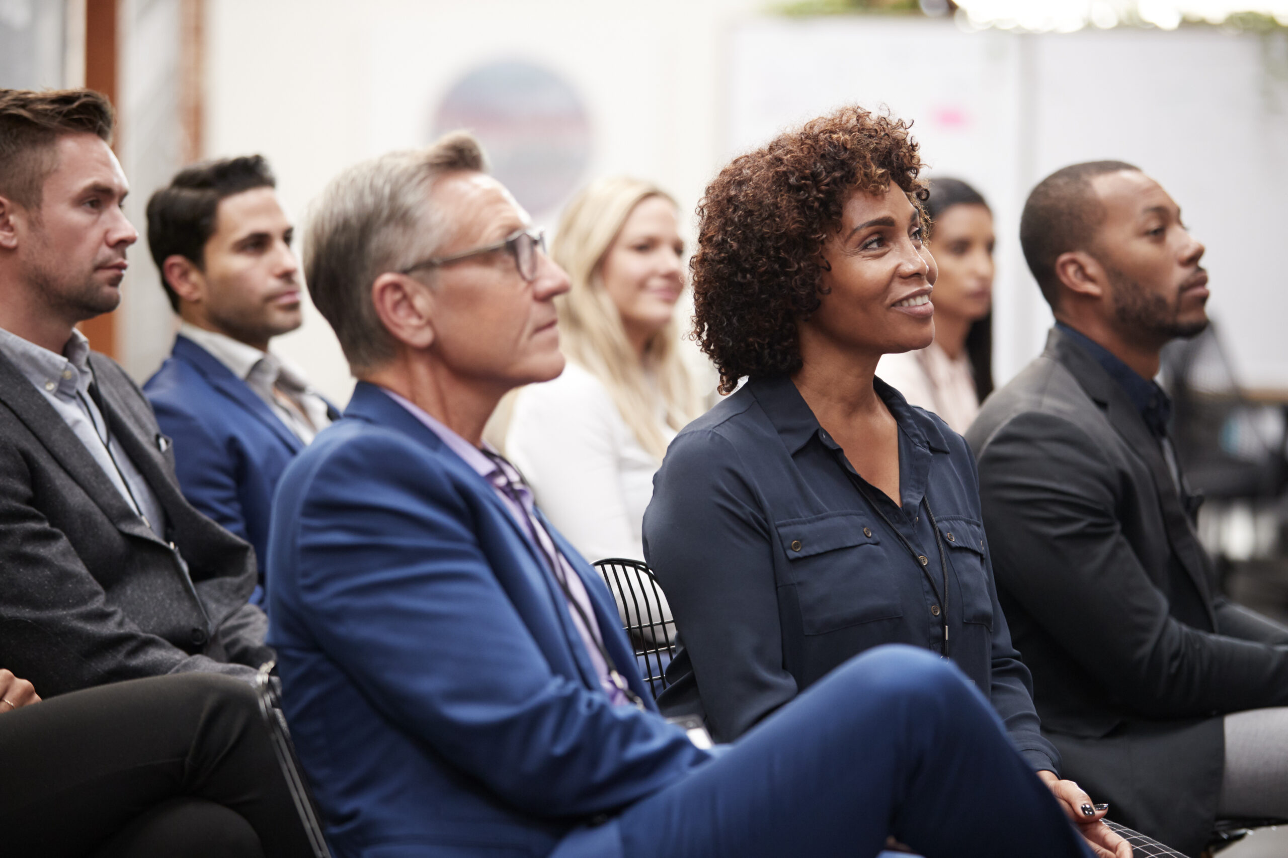 Group of diverse business people listening at a conference