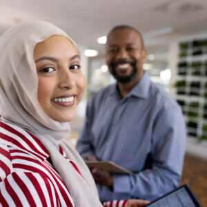 happy diverse female and male business people looking at the camera