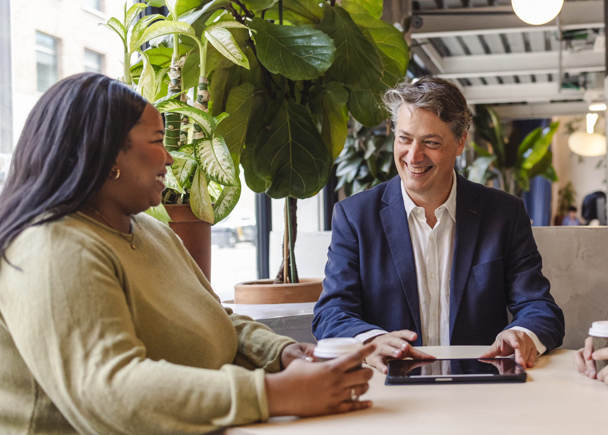 Business people having a meeting using a tablet
