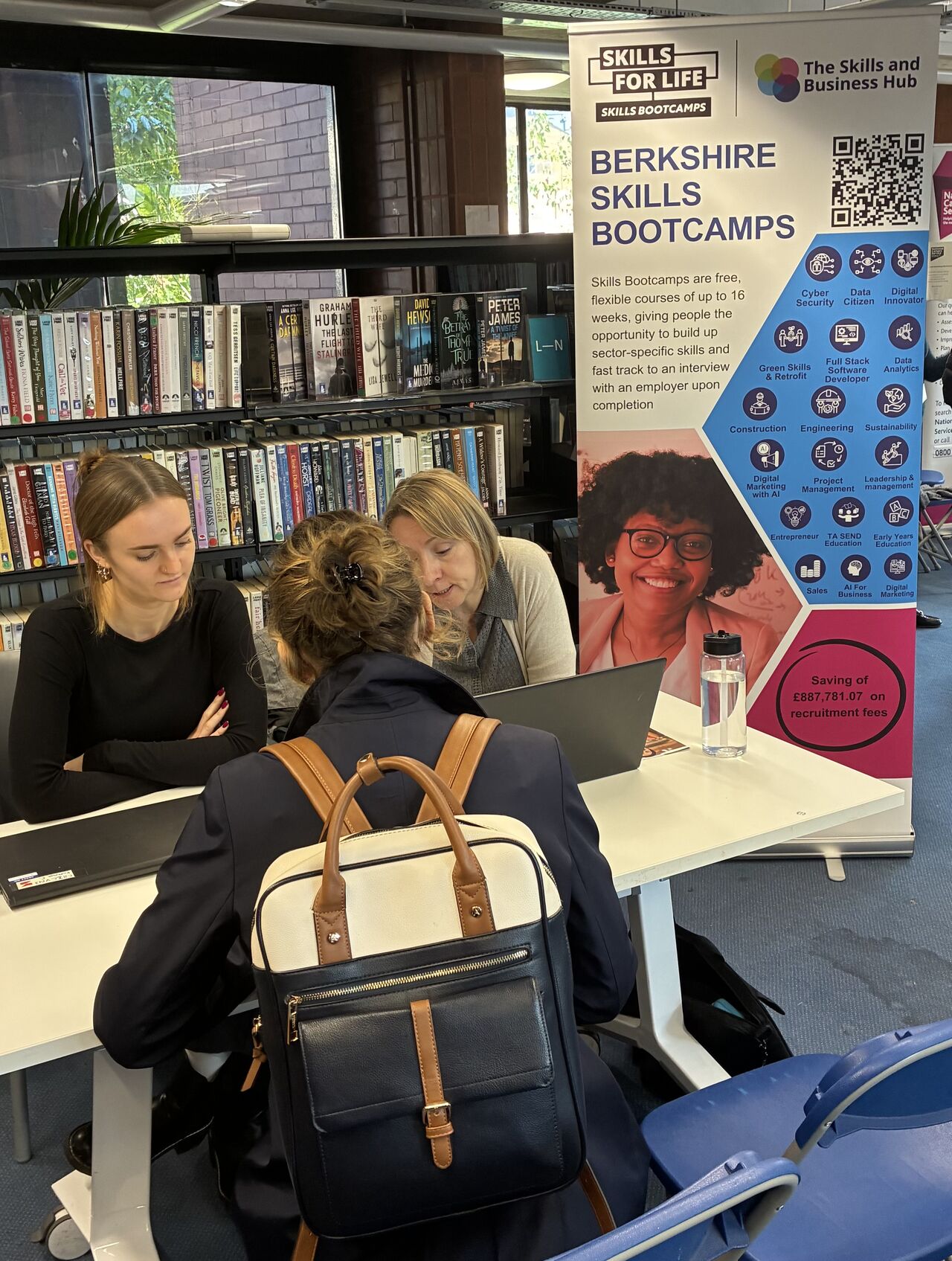 Kathryn and Rachel from SBC team talking to an individual at Maidenhead Jobs Fair