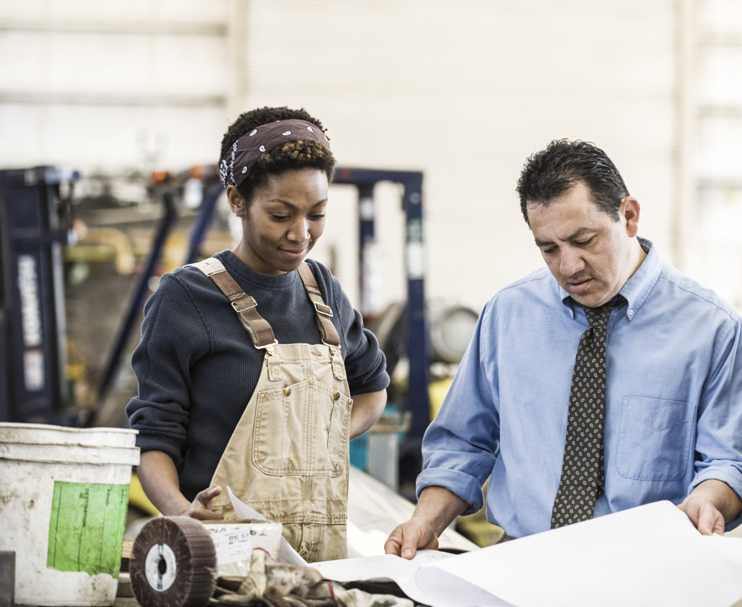 Woman and man at work discussing.